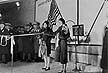 The daughters of Fred Martin and Judson Bradway untie a ribbon at the         international boundry line during the opening ceremonies.
