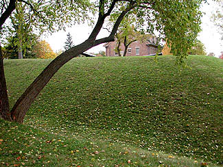 The embankment around Fort Malden. To make a fort harder to attack, a deep ditch was dug outside of the walls. The earth was piled to create a steep hill on the inside.