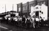 View from east side of Walker Rd. looking west at picketers in front of Motor Products and General Motors, 1956