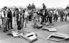 Angry Chrysler workers among Minivan doors they have removed from a supply truck and scattered, 1982