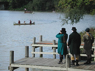 Re-enactors looking for arrival of boat